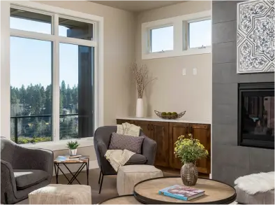 View of cozy living area with a fireplace and natural light flowing through out.